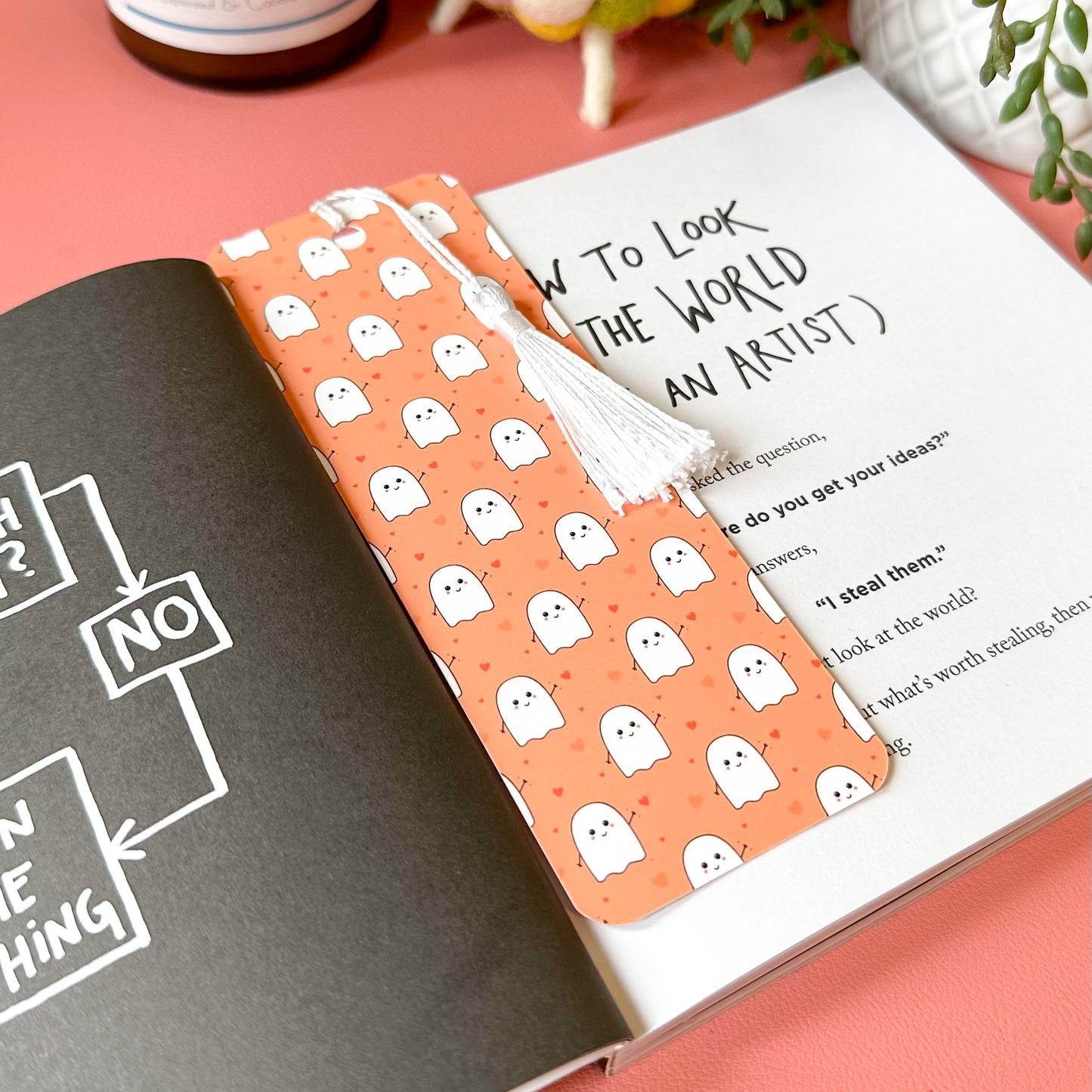 ghost bookmark on pink desk