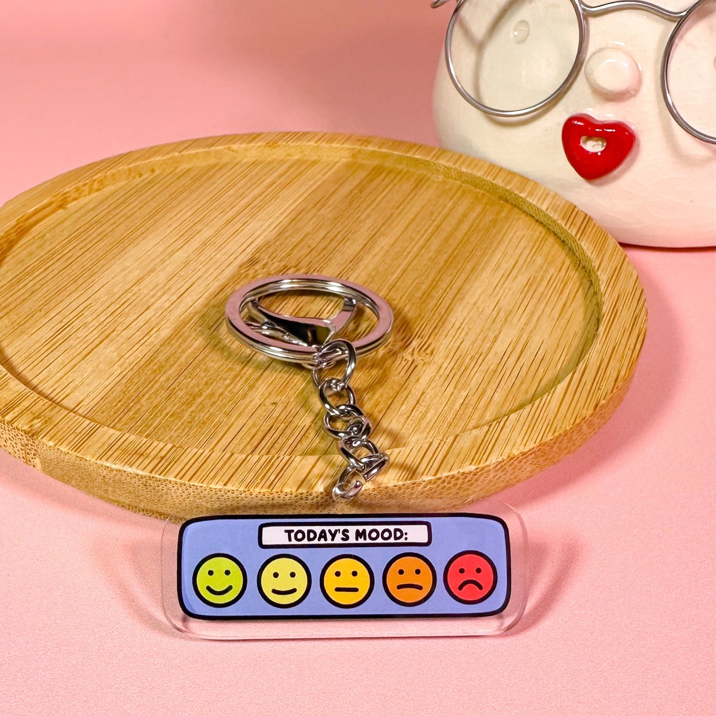 mood tracker keyring on pink background