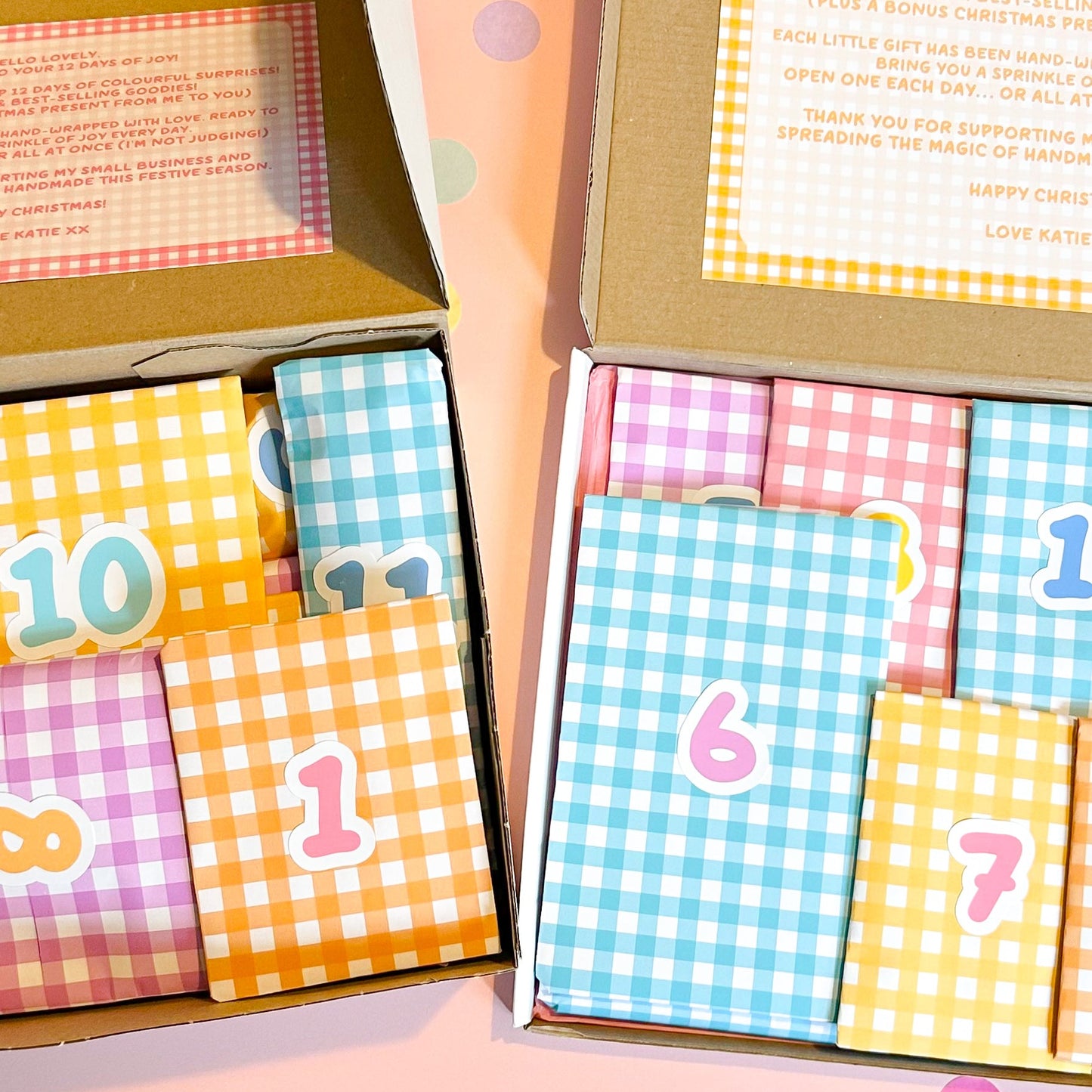 Colorful stationery advent box on a pink background