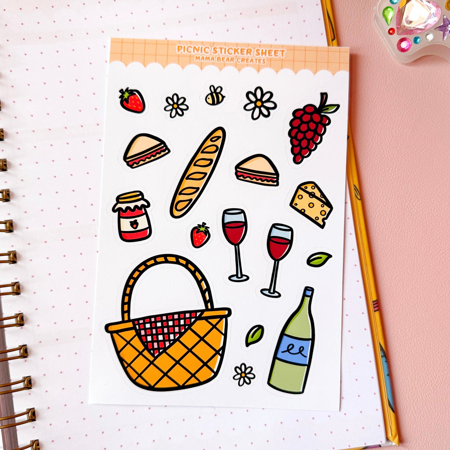 Sticker sheet with picnic-themed illustrations on a notebook page.