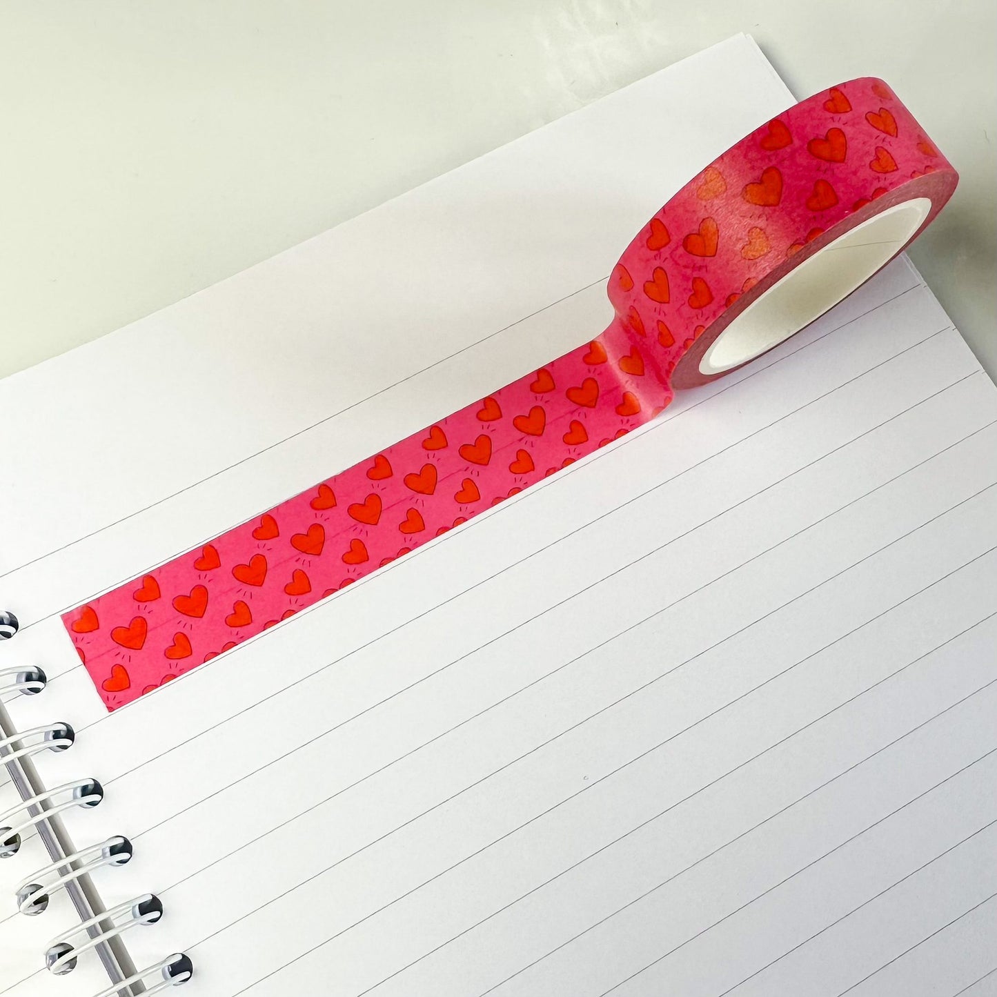 pink and red heart washi tape on notebook