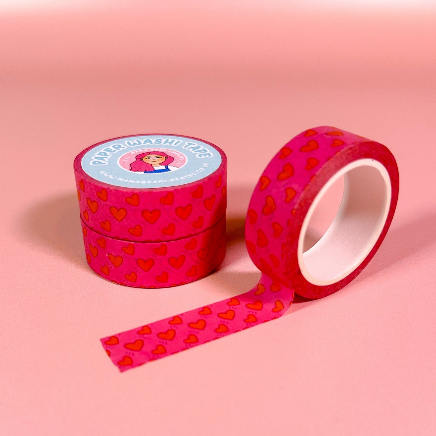Pink washi tape with heart pattern on a pink background