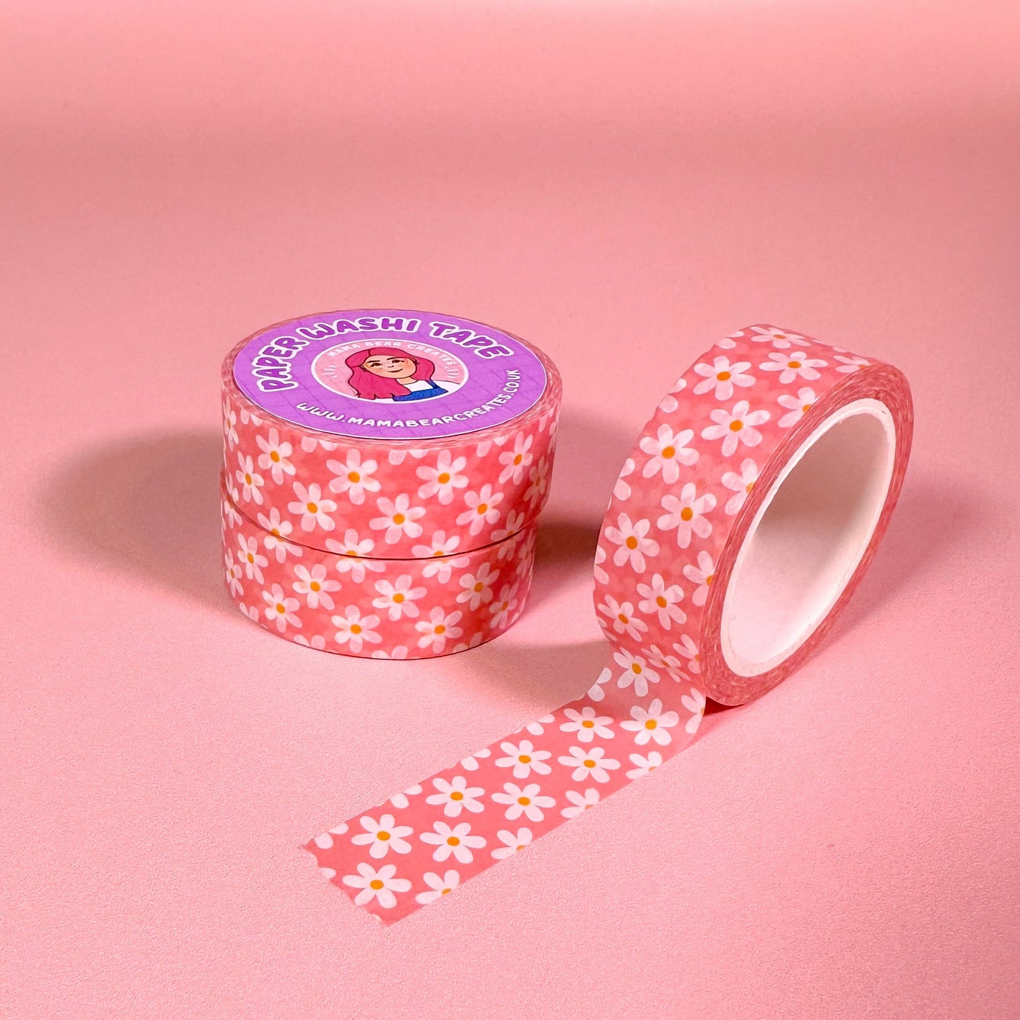 daisy-patterned washi tape with a pink background