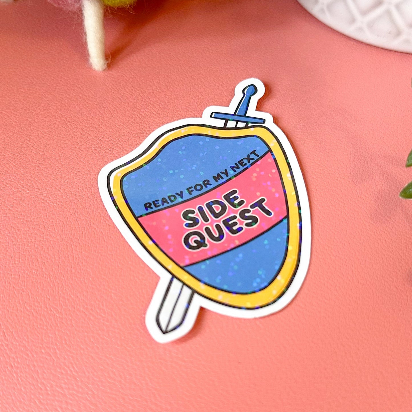 Colorful sticker with 'Ready for my next side quest' text on a pink background