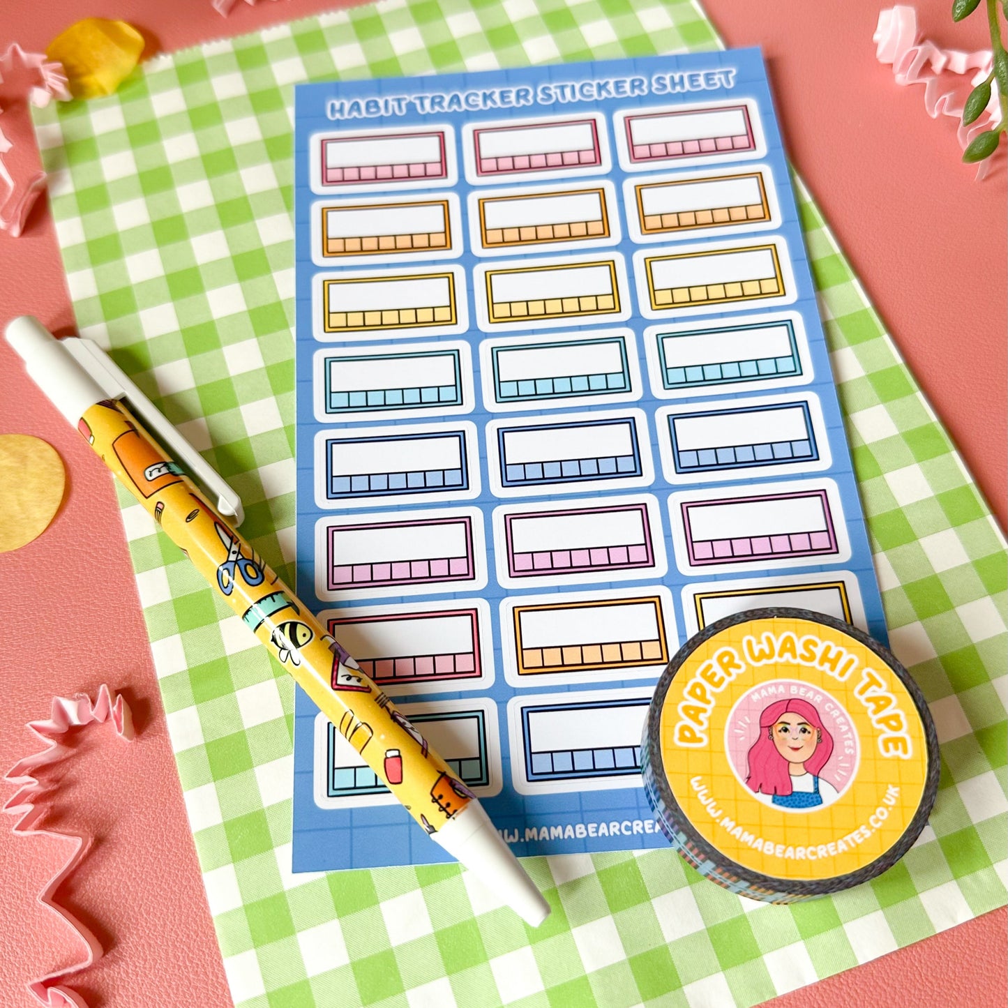 Sticker sheet with colorful labels on a with a pen and badge.