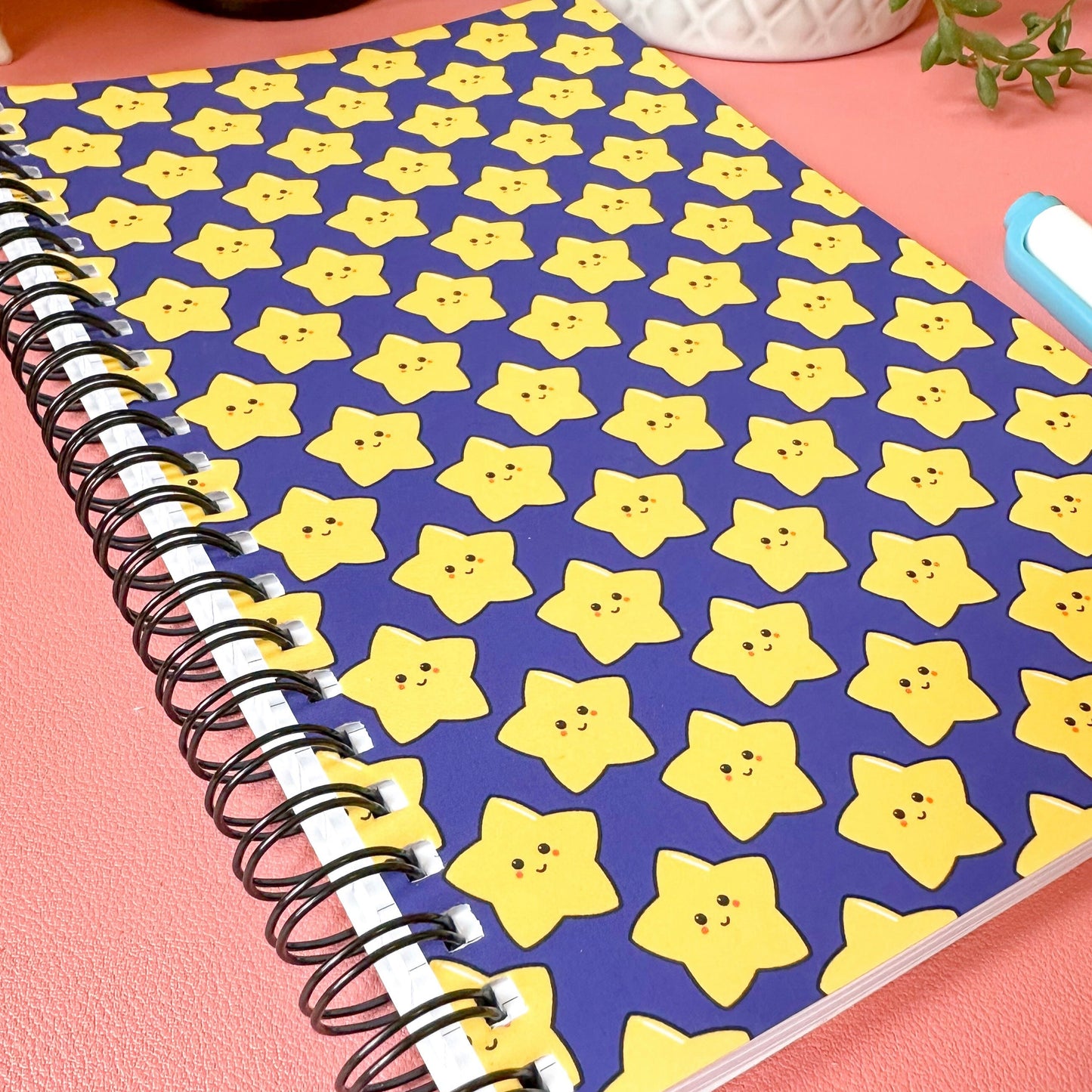 star notebook on pink background