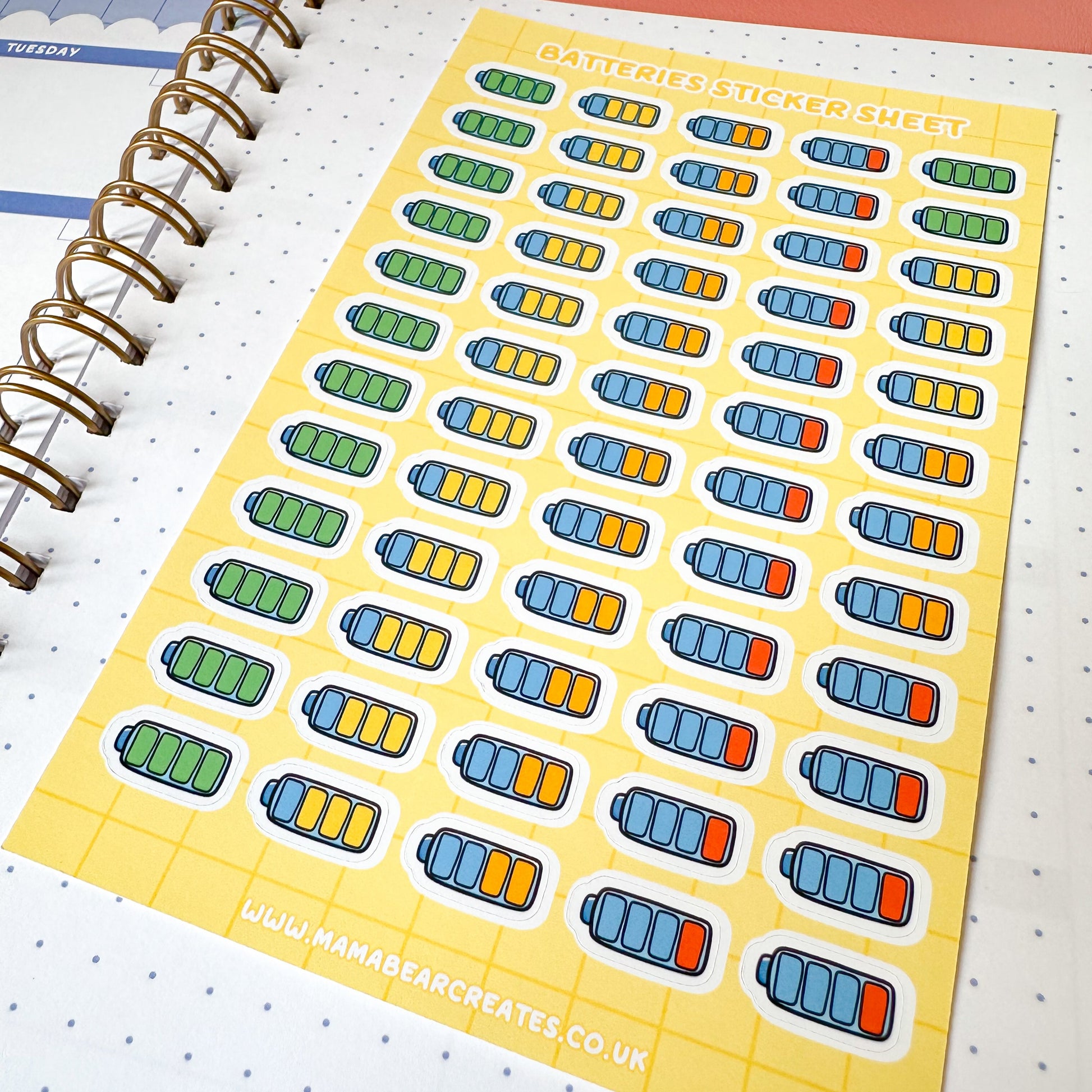 Sheet of battery stickers on a planner page 