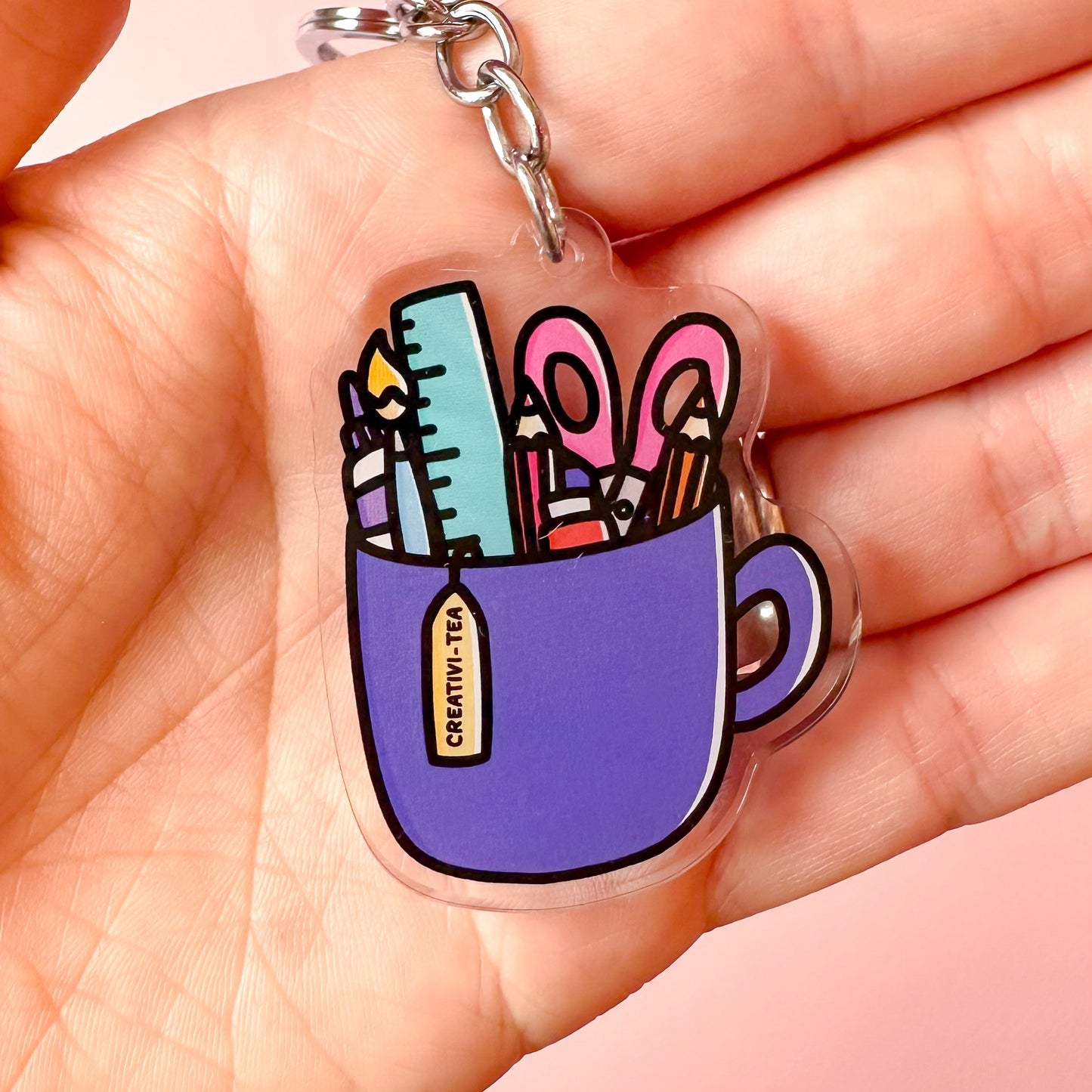 keyring of a cup and art supplies saying creative-tea
