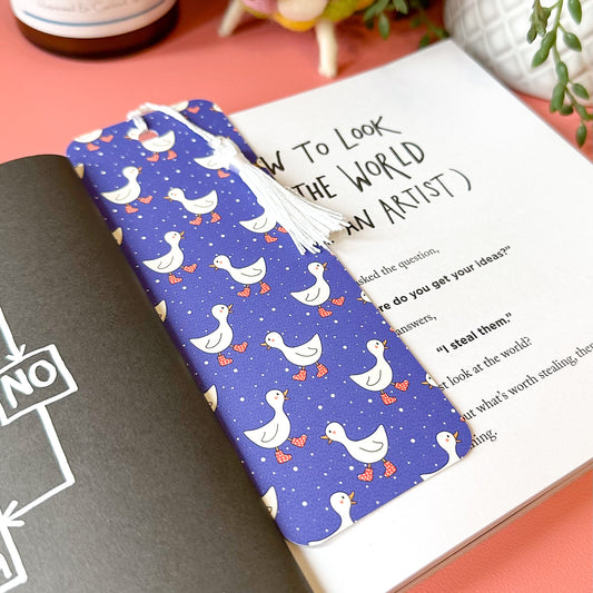 Blue bookmark with duck pattern on a book