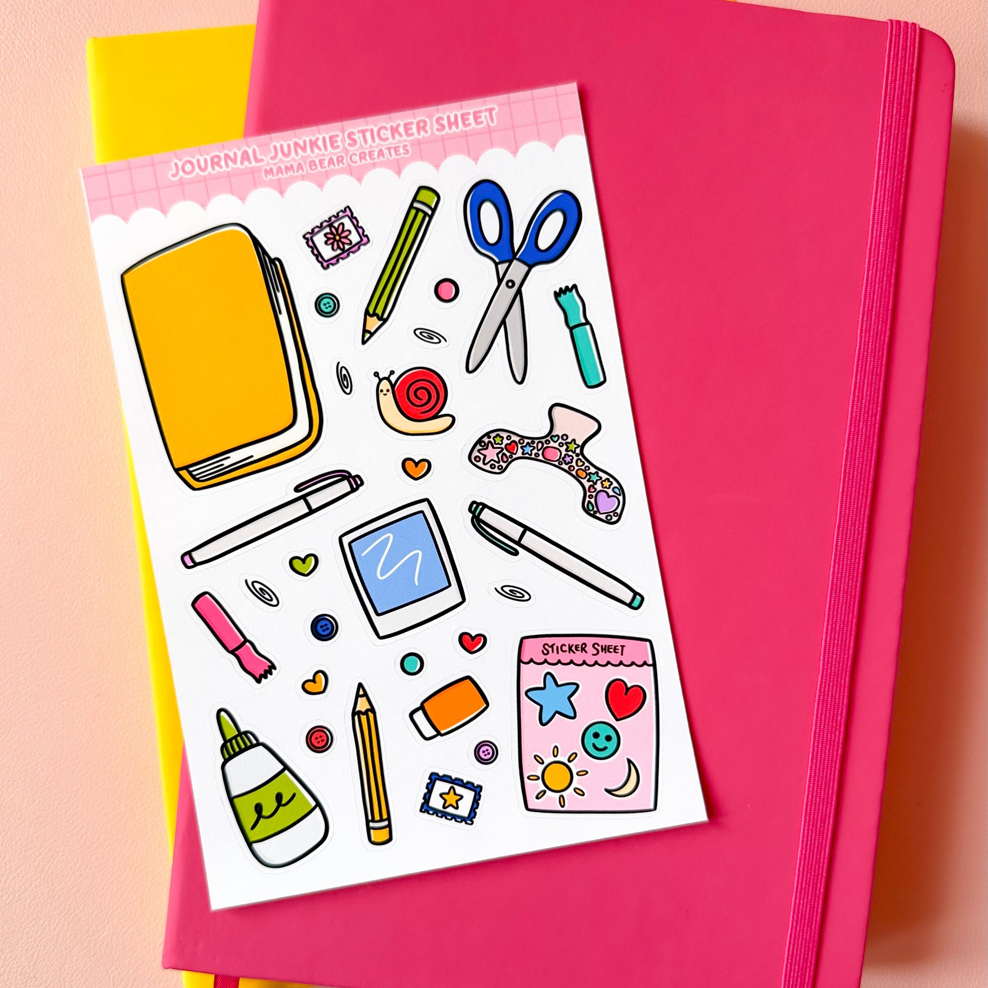 Sticker sheet with stationery items on a pink notebook