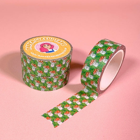 Green mushroom patterned tape on a pink background