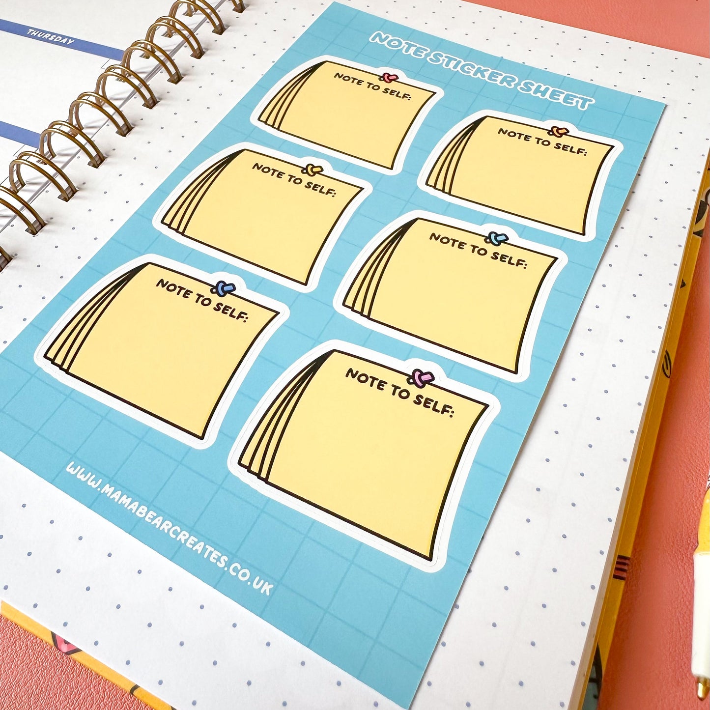 Sheet of 'Note to Self' stickers on a notebook with a blue border.
