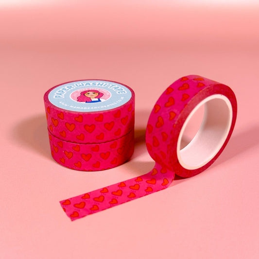 Pink washi tape with heart pattern on a pink background