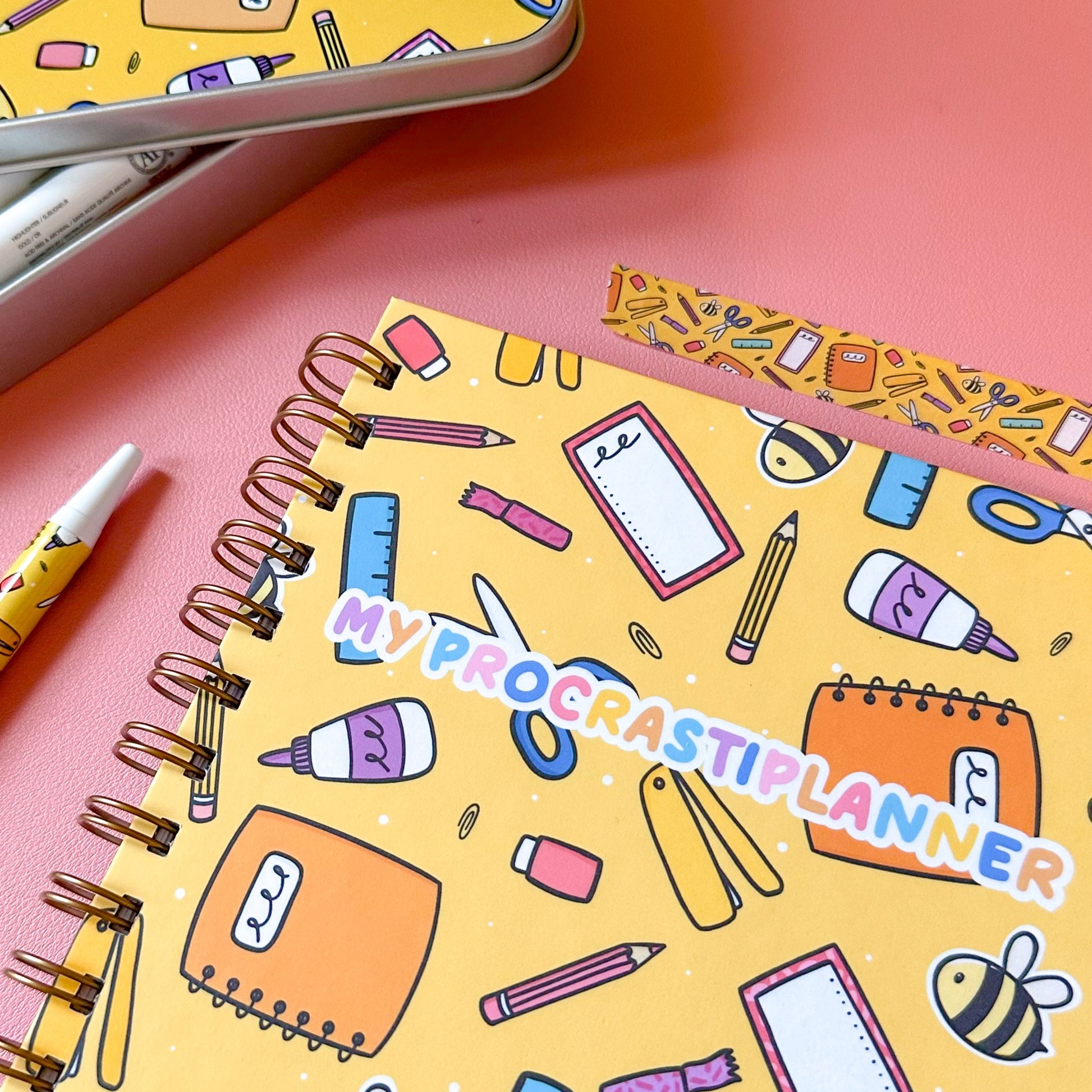 Notebook with 'My Procrastiplanner' design on a pink background