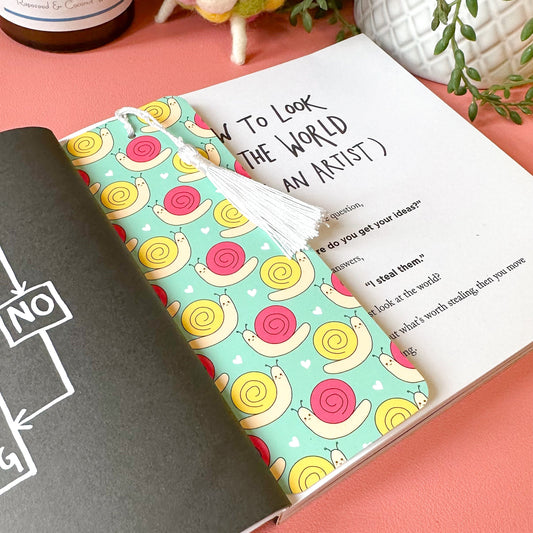 bookmark with colorful snail pattern on a pink surface