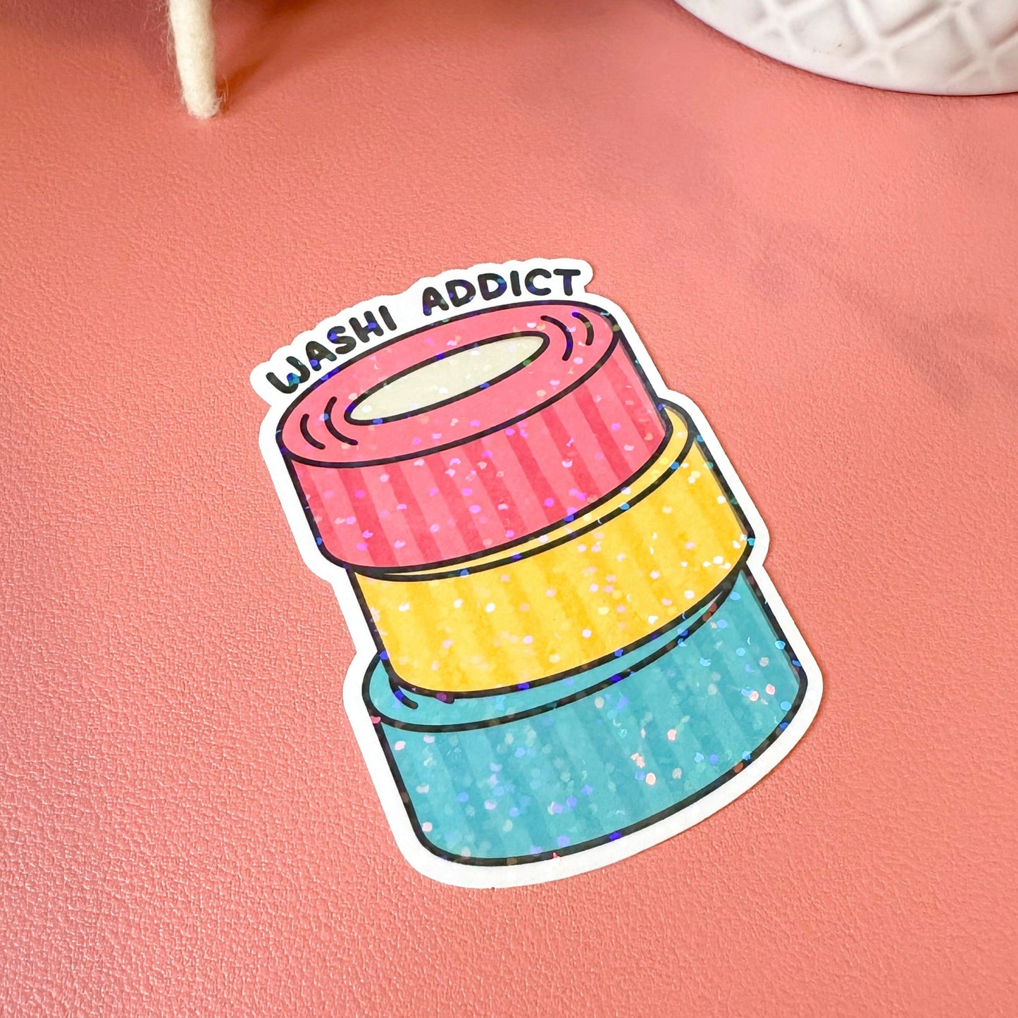 washi addict sticker on pink background