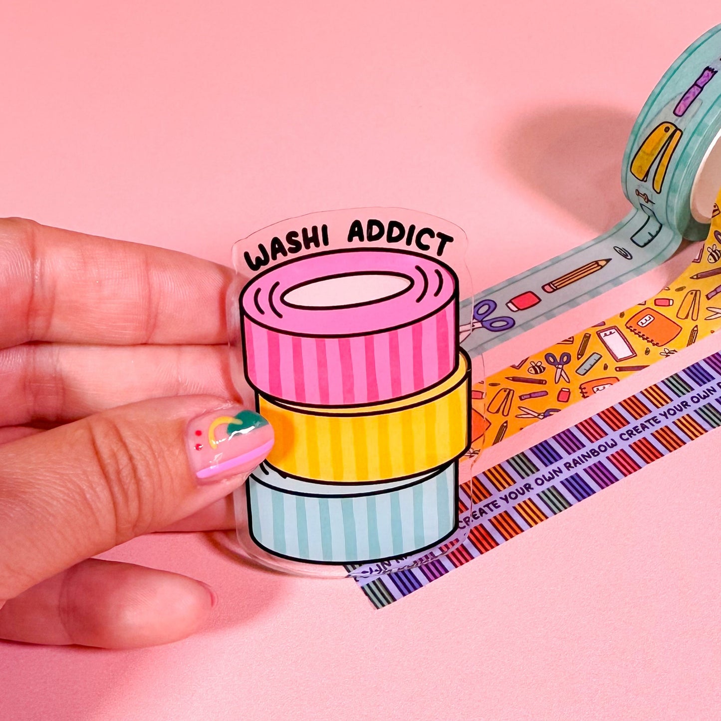 Colorful washi tape with 'Washi Addict' label on a pink background
