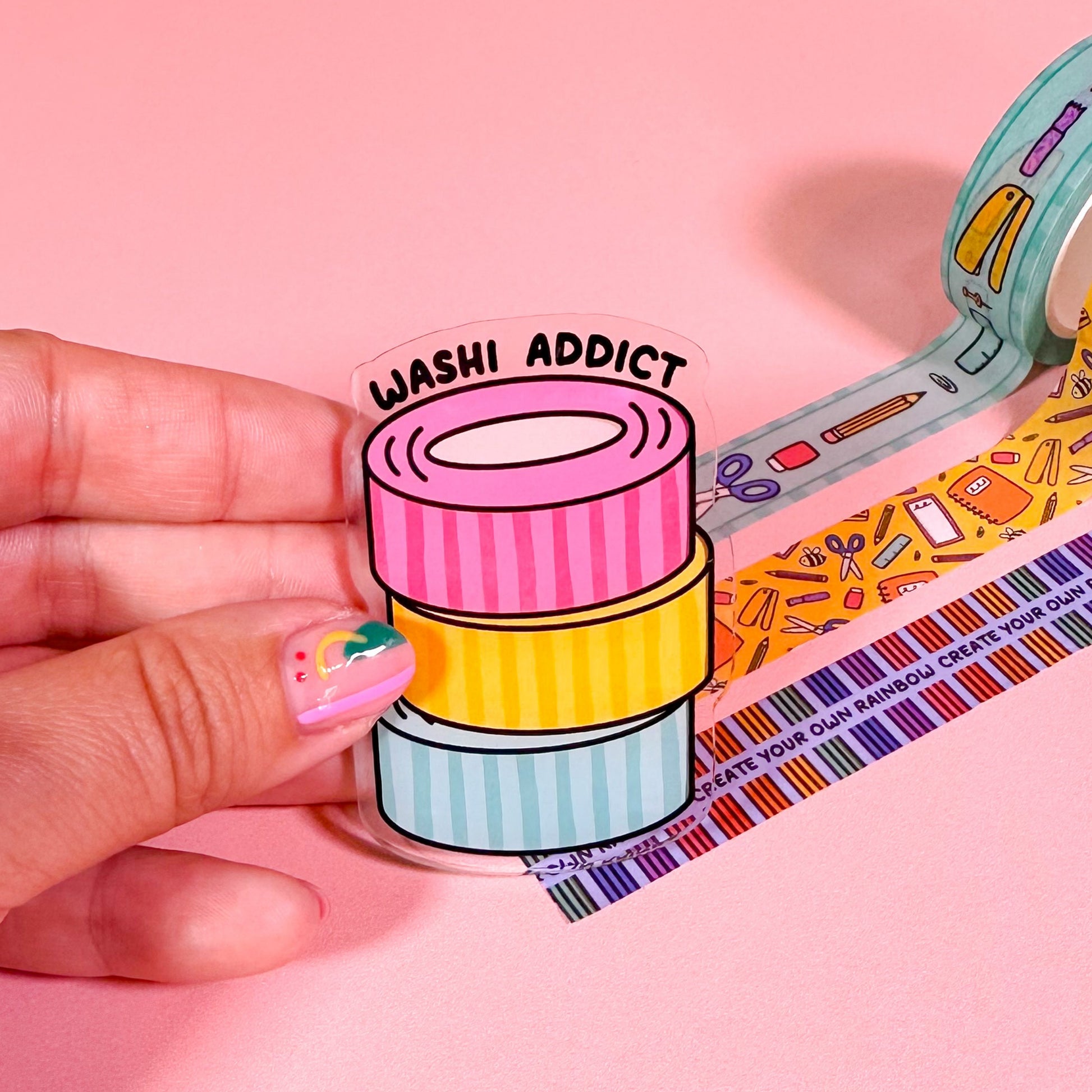 Colorful washi tape with 'Washi Addict' label on a pink background