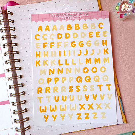 Letter sticker sheet with colorful letters on a pink background